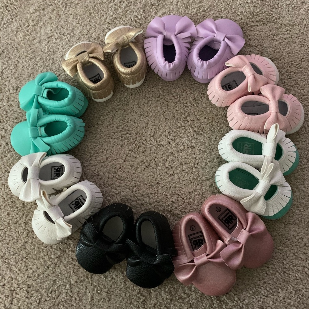 Eight brand new pairs of baby moccasins. Size 1